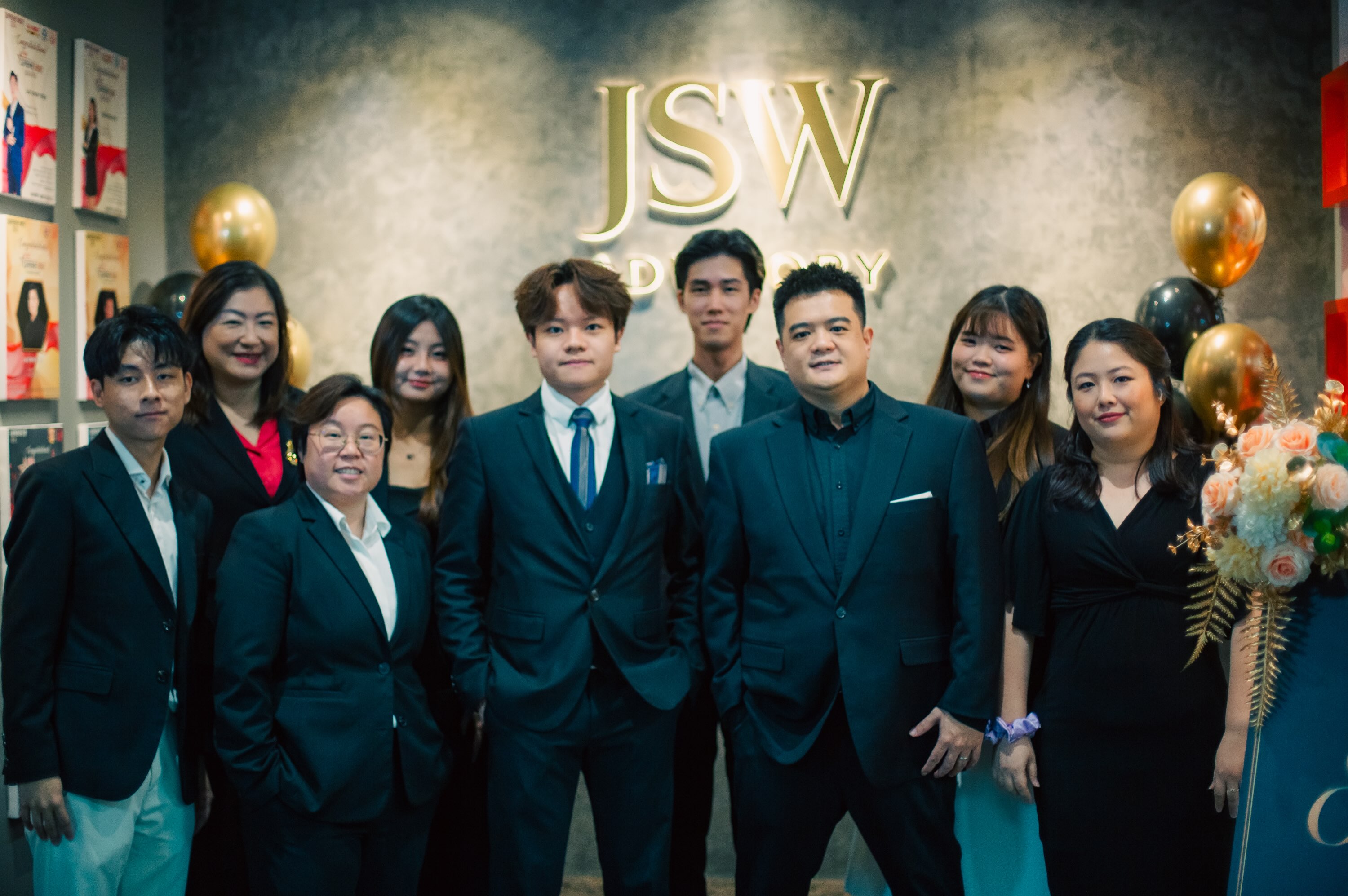 JSW colleagues posing together at their office