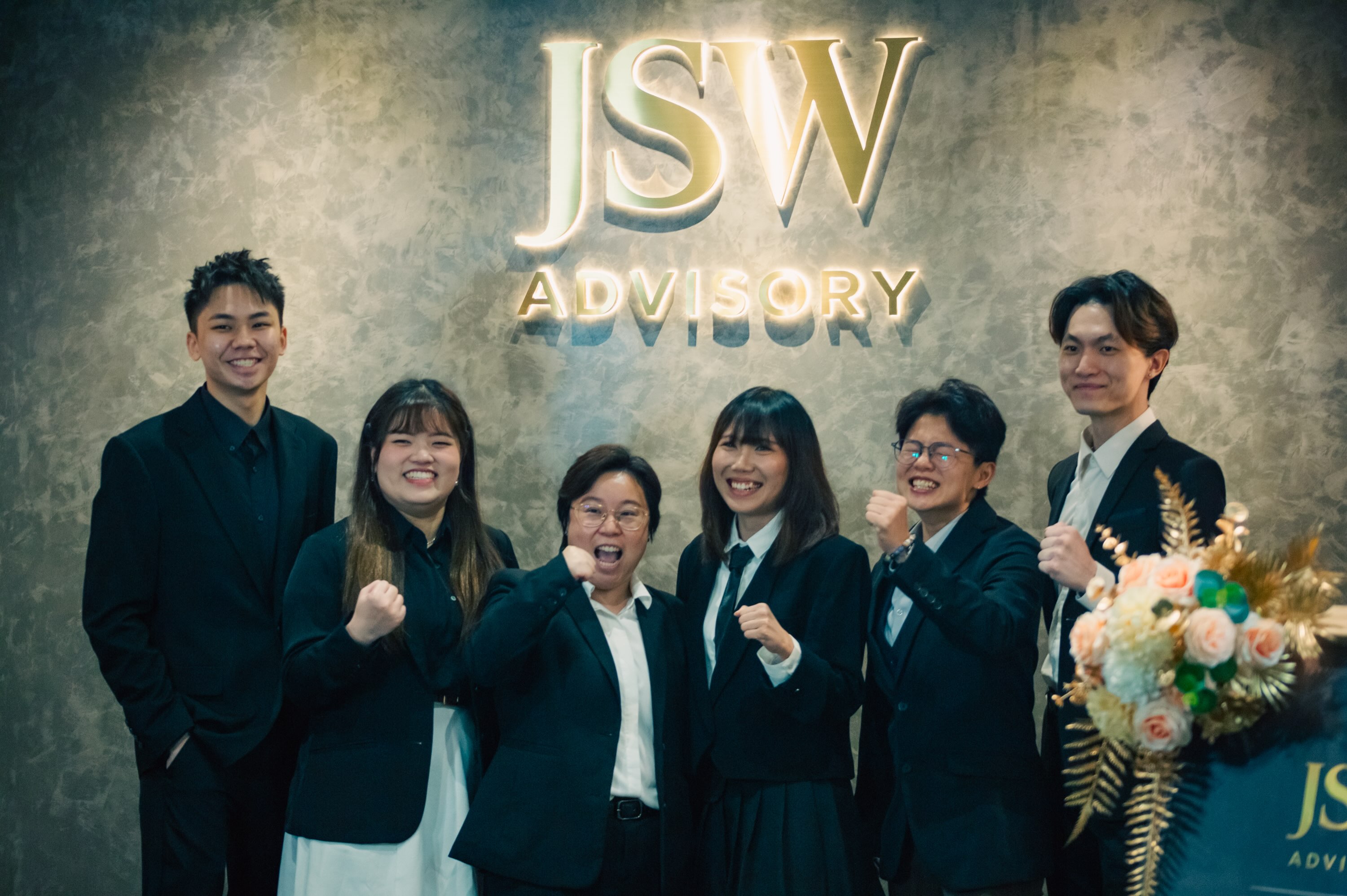 JSW colleagues celebrating together at the office
