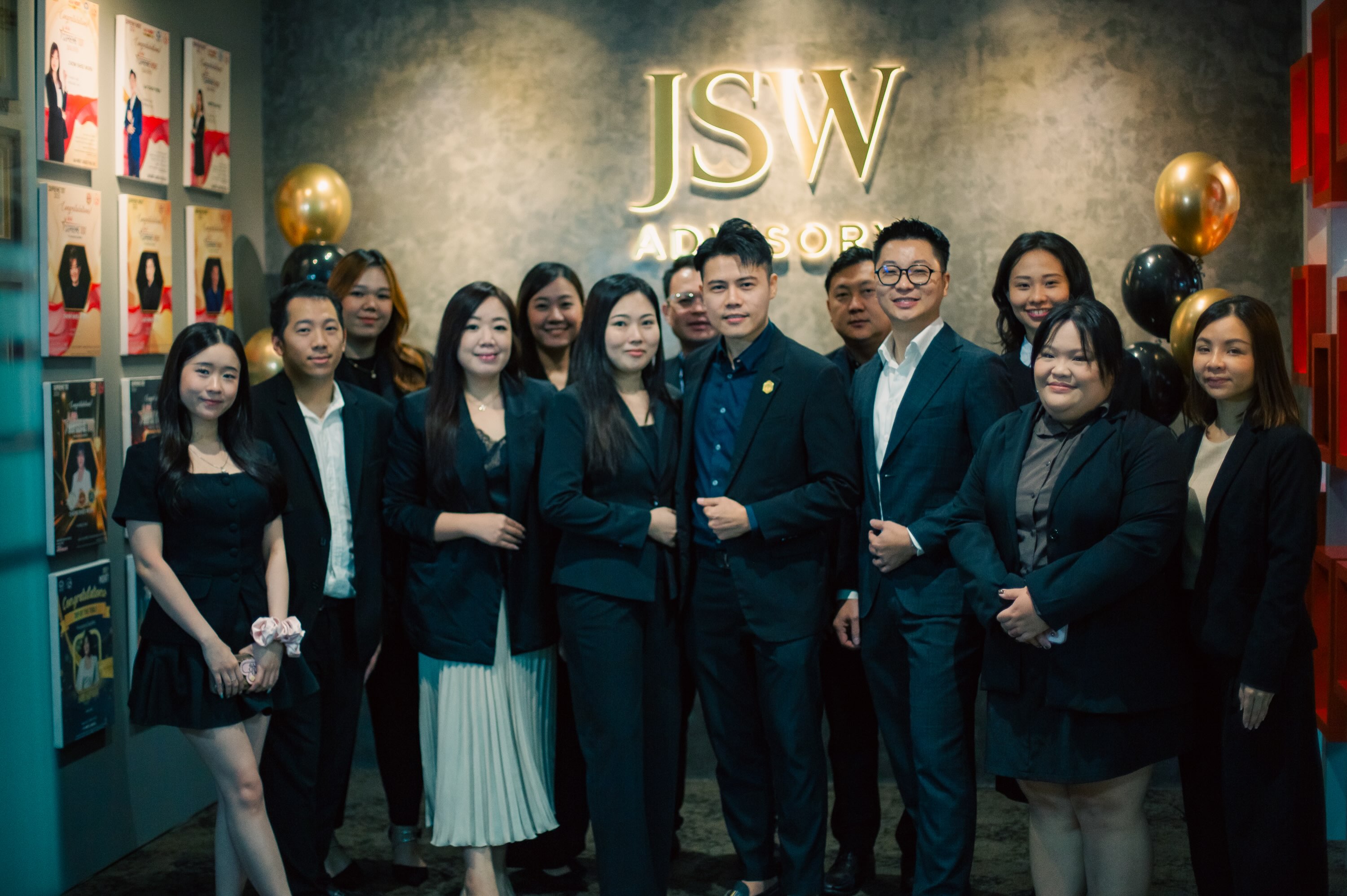 JSW colleagues standing together inside the office